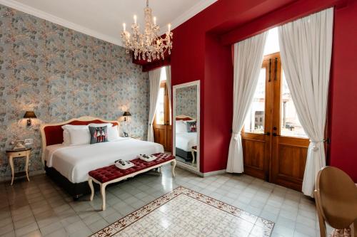 Un ou plusieurs lits dans un hébergement de l'établissement La Concordia - Boutique Hotel