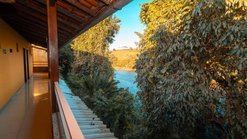 a view of a river from a house at Pousada Itajuípe- Unidade Itabuna-Ba in Itabuna