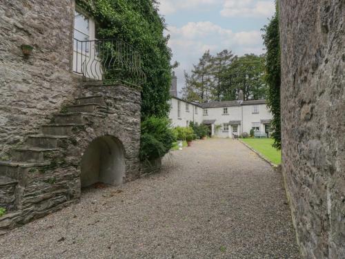 an alley in front of a stone building at The Old Kitchen in Grange Over Sands