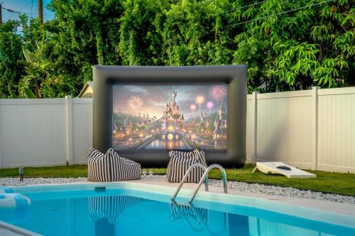 a tv screen sitting on top of a pool at The Beverley Pool Hot Tub Near Clearwater Beach in Clearwater