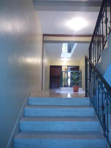 a staircase with blue steps in a house at Posada Dilia del Alba in Santo Domingo