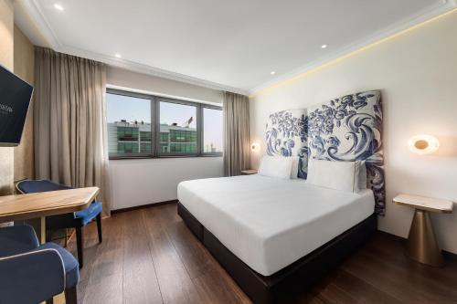 Кровать или кровати в номере Eurostars Universal Lisboa