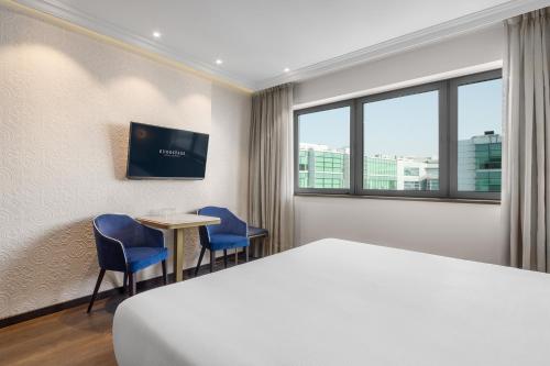 Телевизор и/или развлекательный центр в Eurostars Universal Lisboa