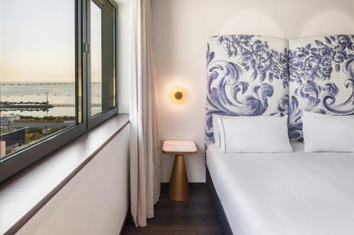 Кровать или кровати в номере Eurostars Universal Lisboa