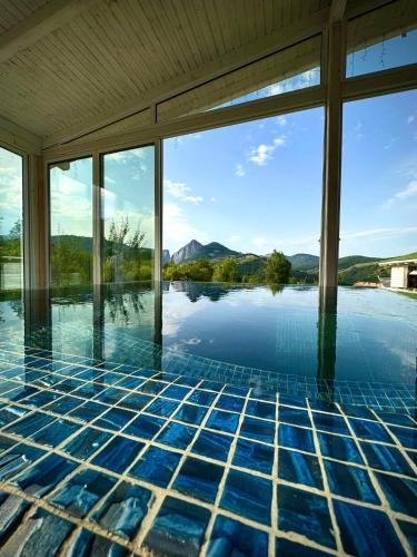 a swimming pool with a view of the water at Cabana Zouk in Poiana Aiudului