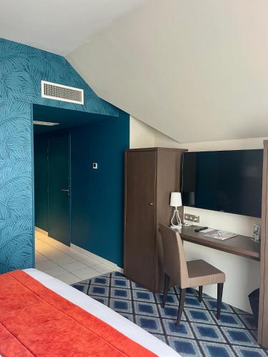 Ένα ή περισσότερα κρεβάτια σε δωμάτιο στο Mercure Chartres Centre Cathedrale