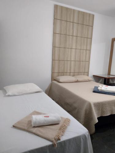 Katil atau katil-katil dalam bilik di Hotel Chalé Centro