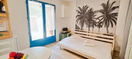 Ένα ή περισσότερα κρεβάτια σε δωμάτιο στο Ambiance surf et détente à Biscarrosse Plage