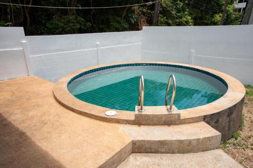 a swimming pool in a backyard with a concretescribedscribedscribed at 640 Villa in Ko Lanta