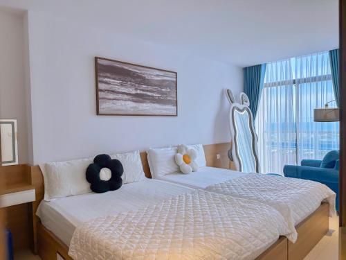 Letto o letti in una camera di CSJ Seaside - Căn Hộ Cạnh Biển