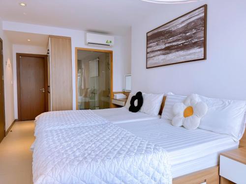 Letto o letti in una camera di CSJ Seaside - Căn Hộ Cạnh Biển