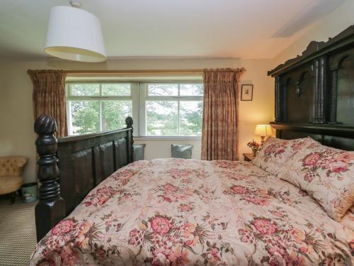 En eller flere senge i et værelse på The Laundrymaid's Cottage