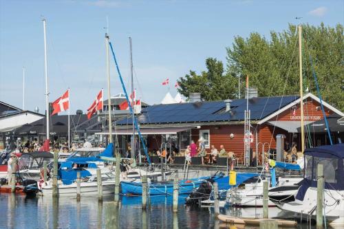 a group of boats are docked at a marina at 40332-Juelsminde-Niels-Rasmussens-Vej-56 in Sønderby