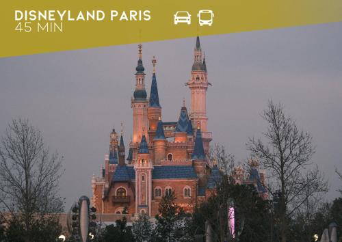 a castle in disneyland paris with a sign in front of it at L'essentiel, calme et climatisé - Accès autonome in La Ferté-Gaucher