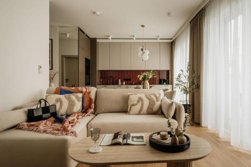 a living room with a couch and a table at Electra Apartments in Krakow