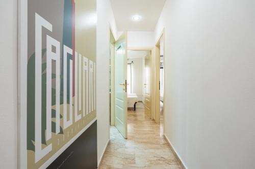 a hallway with a hallway leading to a bathroom at Appartamento Cagliari centro con vista sul porto in Cagliari