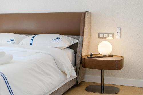 Ένα ή περισσότερα κρεβάτια σε δωμάτιο στο SeaShell Suites