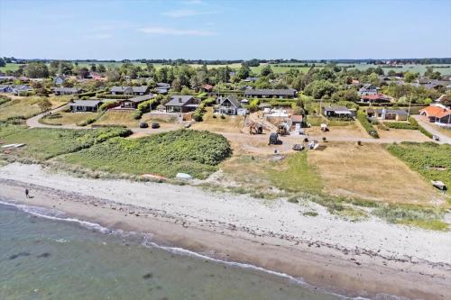 an aerial view of the shoreline of a beach at 30582-Odder-Dyngby-Havvej-66 in Odder