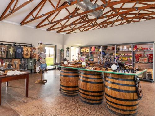 a room with three large wooden wine barrels at Flying Ostrich Guesthouse & Self-catering Accommodation in Mariental