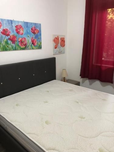 a bedroom with a bed and a window at Villaggio 101 Pini in Buonfornello