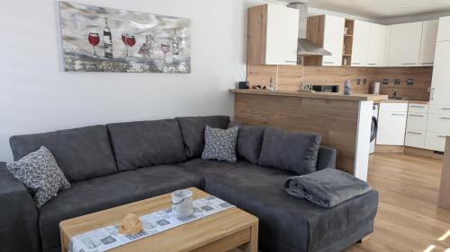 a living room with a couch and a table at Ankerplatz35 in Carolinensiel