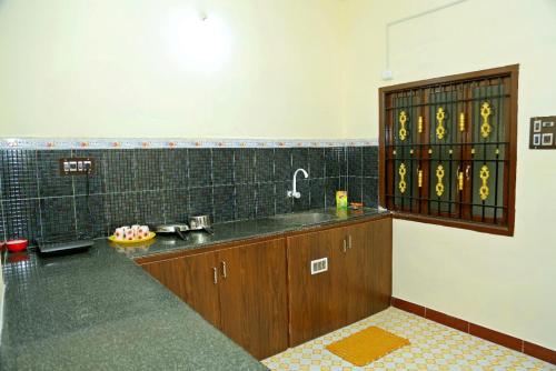 a kitchen with a sink and a counter top at Relax inn villa 3BHK in Puducherry