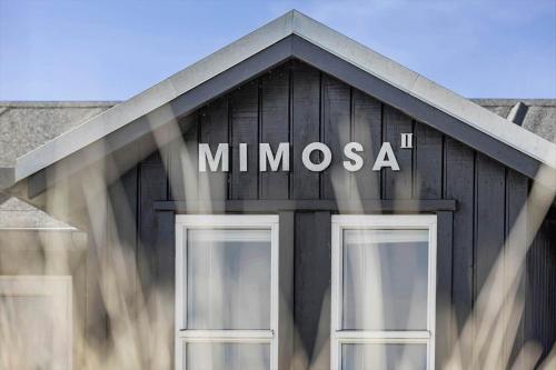 a black building with the word mimosa on it at 30594-Odder-Toldvejen-45-H in Odder