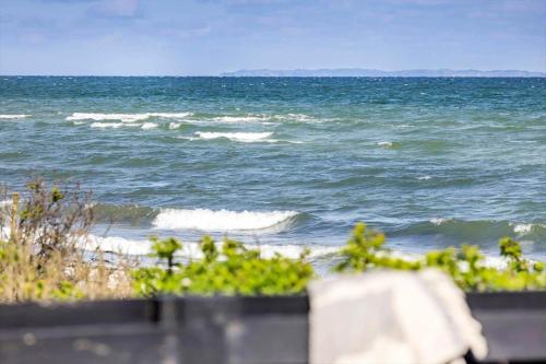 a view of the ocean from a balcony of a beach at 30594-Odder-Toldvejen-45-H in Odder