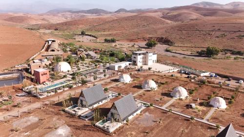 an aerial view of a village in the desert at The Ranch Camp in El Karia