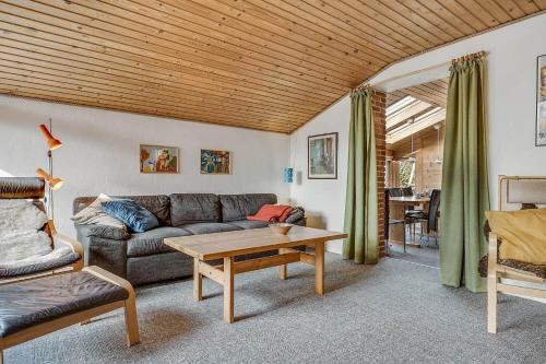 a living room with a couch and a table at 30069-Beder-Hogevaenget-12 in Beder