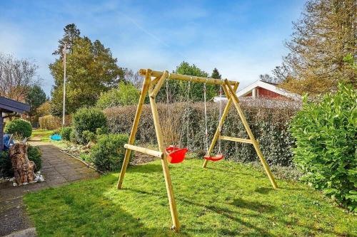 a swing set in a yard with grass at 30069-Beder-Hogevaenget-12 in Beder
