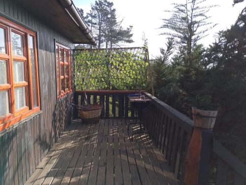 a porch of a house with a wooden deck at Cabaña en Laguna Verde in Laguna Verde
