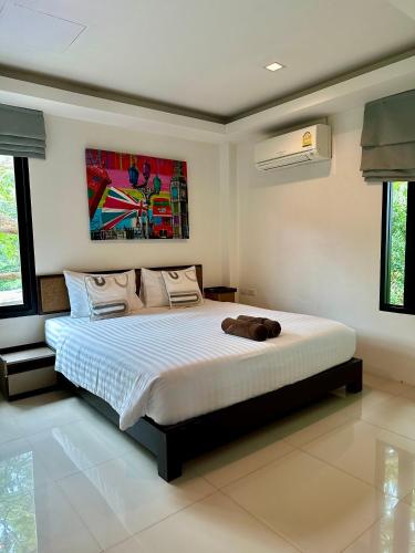 Cama o camas de una habitación en Sunset Bay View Phuket