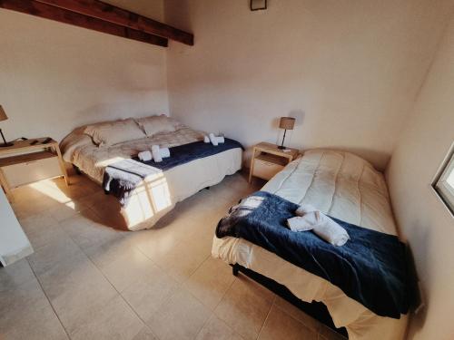 a bedroom with two beds in a room at La quinta in Esquina