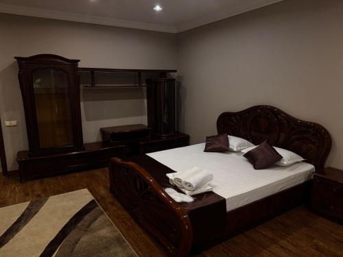 a bedroom with a bed with a mirror and a dresser at Sky luxe-hotel Astana in Astana