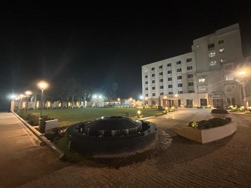 a city street at night with a building at Hotel Yuvraj Dx in Pipra Dewās