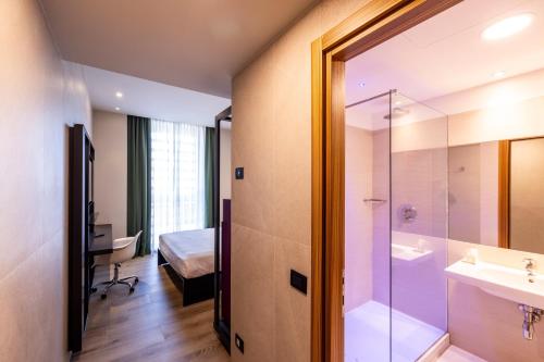 a bathroom with a shower and a sink at Hotel degli Arcimboldi in Milan
