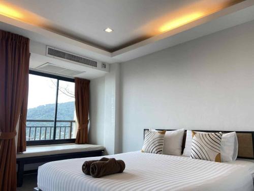 Cama o camas de una habitación en Sunset Bay View Phuket