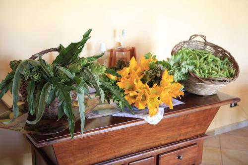 two baskets of plants and flowers on a table at Al Canei B&B in Asti
