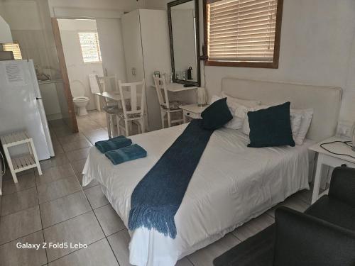 Katil atau katil-katil dalam bilik di Donum Ex Deo Self catering units