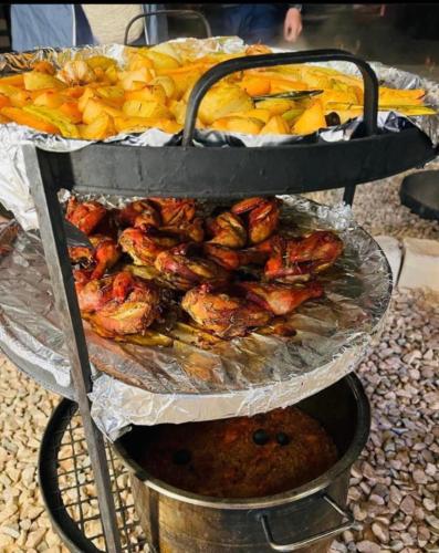 a tray of food with shrimp and other foods on it at Wadi Rum, Hala bubbles in Wadi Rum