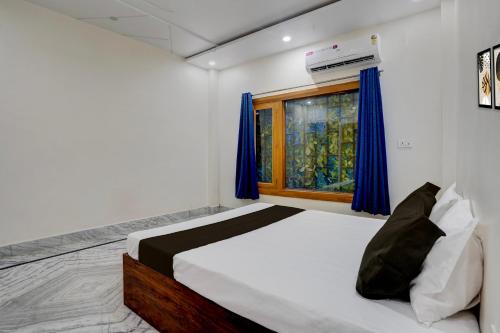 Ένα ή περισσότερα κρεβάτια σε δωμάτιο στο Hotel O Pristine inn