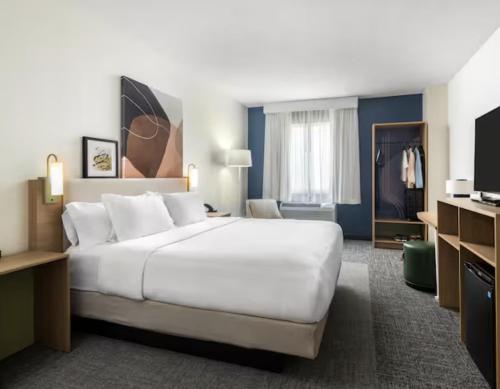 a large white bed in a hotel room at Spark by Hilton Matteson Chicago I 57 in Matteson