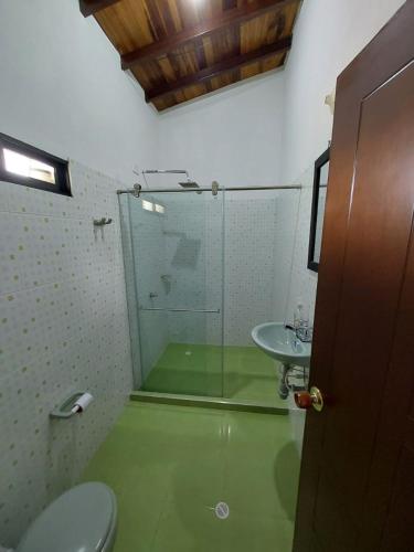 a bathroom with a toilet and a sink at Finca Guacari (San Gil) in San Gil