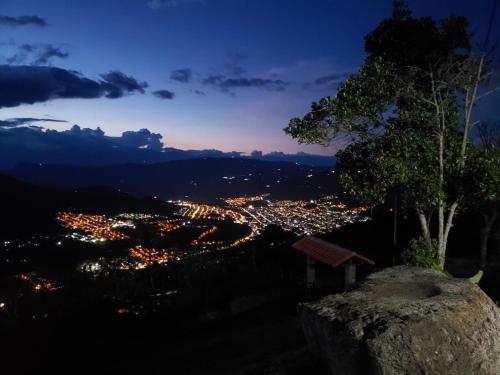 a view of a city at night at Finca Guacari (San Gil) in San Gil