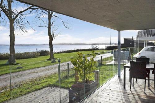 a view of the water from the balcony of a house at 40342-Juelsminde-Niels-Rasmussens-Vej-125 in Sønderby