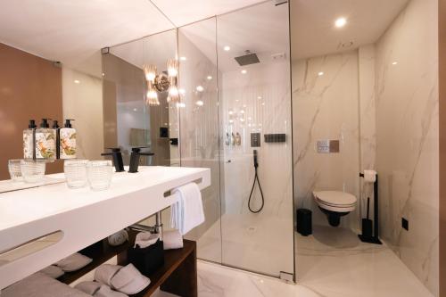 a bathroom with a shower and a sink and a toilet at Quinta de Silvalde in Santo Tirso