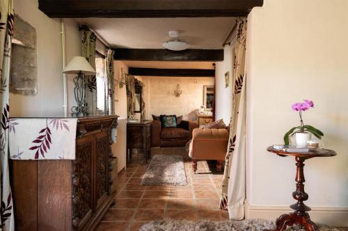 a hallway with a living room with a couch at Dannah Farm Country House in Shottle