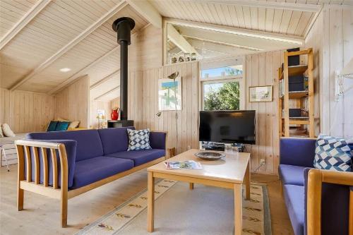 a living room with a blue couch and a table at 30098-Malling-Norsmindevej-171-K in Malling
