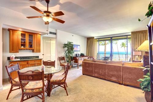 a living room with a couch and a table at Napili Point by KBM Resorts in Kaanapali